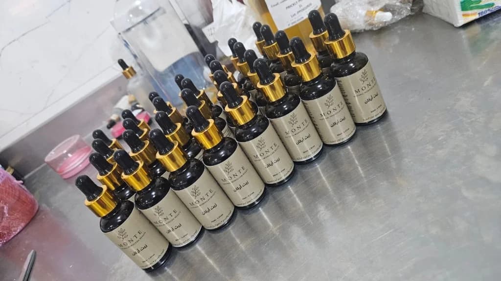 Custom labeled argan oil dropper bottles in bulk